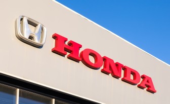 Honda Dealership Sign Against Blue Sky